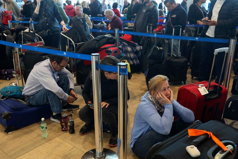 Passengers wait for their flights during a strike at the Ben Gurion International Airport near Tel Aviv. AFP
