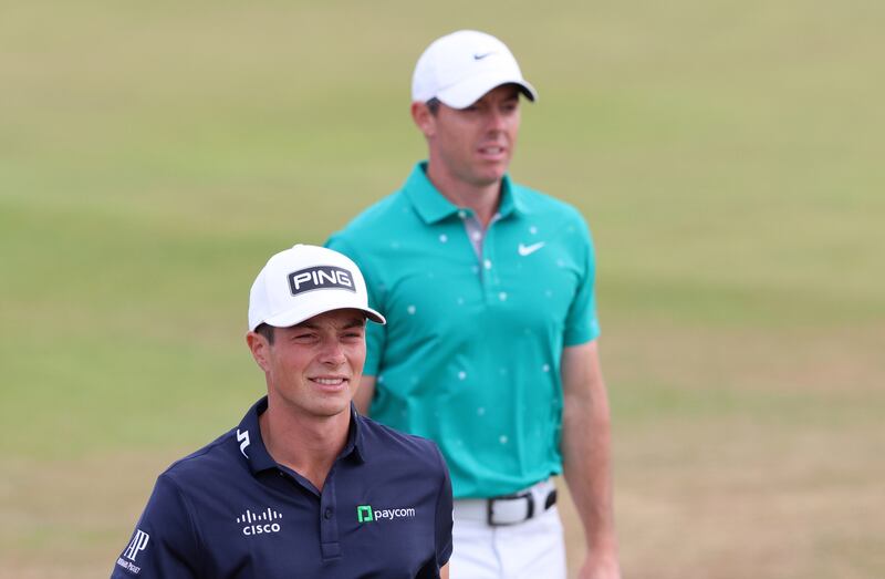 Viktor Hovland (l) with  Rory McIlroy during the third round. EPA