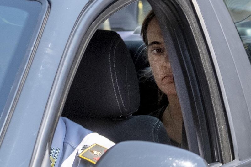 German captain of humanitarian ship Sea-Watch 3, Carola Rackete looks onas she arrives in a car of the Italian Guardia di Finanza law enforcement agency on July 1, 2019 to appear before a judge at the courthouse in Agrigento, Sicily.   The captain of migrant rescue ship Sea-Watch 3, Germany's Carola Rackete was due to appear in court on July 1 accused of hitting a police boat while entering Italy's Lampedusa port with 40 people rescued from the Mediterranean. Rackete was arrested after a two week standoff at sea and faces up to 10 years in jail if convicted.
 / AFP / Giovanni ISOLINO
