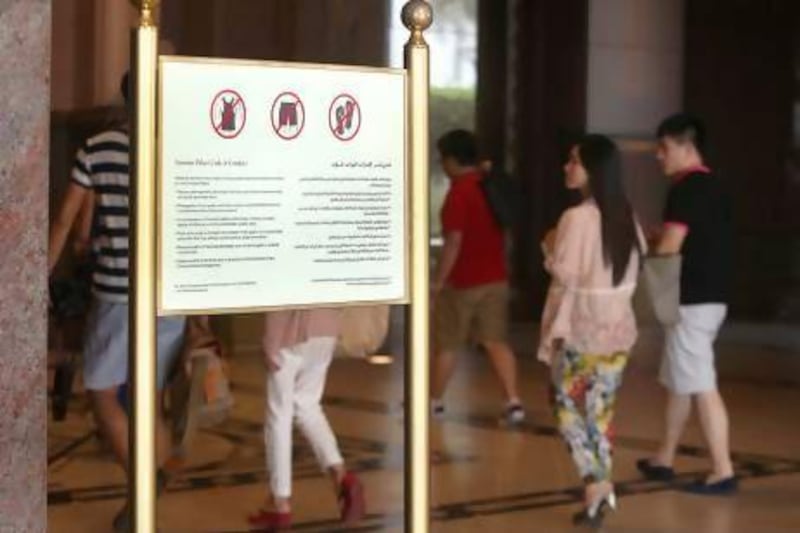 Signs at Abu Dhabi's luxurious Emirates Palace hotel advise westerners to dress more conservatively during Ramadan in public places such as malls, hotels and restaurants. Fatima Al Marzooqi / The National