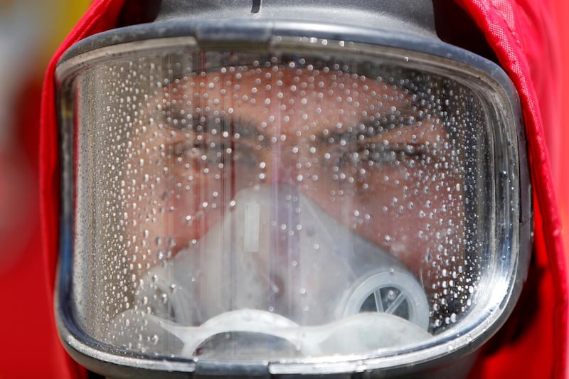 A member of Palestinian Civil Defence wears a face shield as he takes part in a drill for dealing with coronavirus cases, amid concerns about the spread of the disease (COVID-19), in Ramallah in the Israeli-occupied West Bank April 23, 2020. REUTERS/Mohamad Torokman