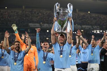ISTANBUL, TURKEY - JUNE 10: Erling Haaland of Manchester City celebrates with the UEFA Champions League trophy after the team's victory during the UEFA Champions League 2022/23 final match between FC Internazionale and Manchester City FC at Atatuerk Olympic Stadium on June 10, 2023 in Istanbul, Turkey. (Photo by Michael Steele / Getty Images)