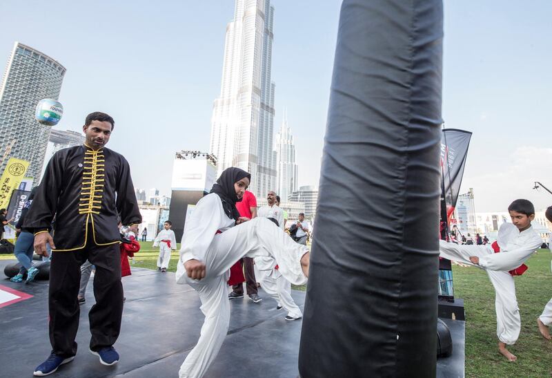 DUBAI, UNITED ARAB EMIRATES - Participants doing workout at the closing weekend carnival of the second year of the Dubai Fitness Challenge at Burj Park, Dubai.  Leslie Pableo for The National