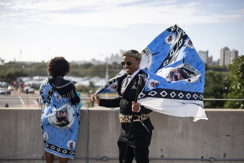A Zulu woman and a man with traditional colours at the Moses Mabhida Stadium in Durban. AFP