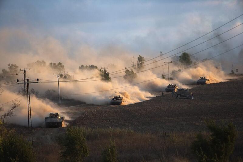 Israeli tanks manoeuvre outside the northern Gaza Strip. Ronen Zvulun / Reuters
