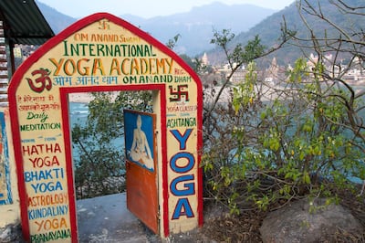 Yoga school sign, Muni Ki Reti, sometimes known as Lakshman Jhula,  Rishikesh area,Tehri Garhwal district, Uttarakhand, India. Getty Images