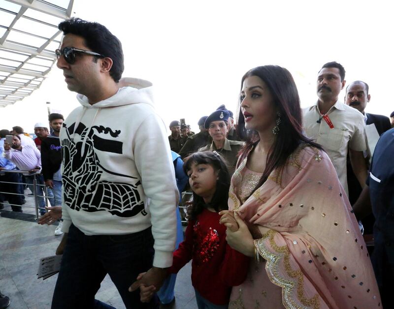 epa08219400 Bollywood actor Abhishek Bachchan (L) with his wife and Bollywood actress Aishwarya Rai Bachchan   at Raja Bhoj airport in Bhopal, India, 15 February 2020. The couple was  on a personal visit to city  EPA-EFE/SANJEEV GUPTA
