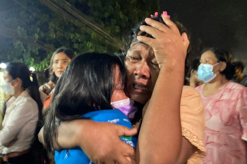A mother reacts after her daughter leaves prison. AP