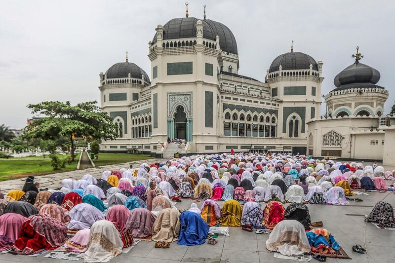 Indonesian Muslims perform Eid prayers at Al Mashun Grand Mosque in Medan, North Sumatra, Indonesia.  EPA