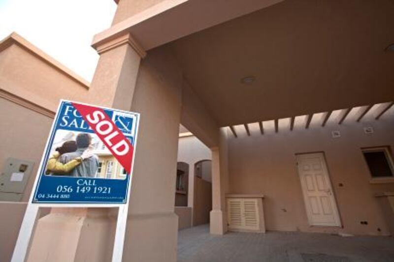 Deira, November 21, 2010 - A sold sign outside a villa in the Springs in Dubai, November 21, 2010. (Jeff Topping/The National) STOCK  property for sale