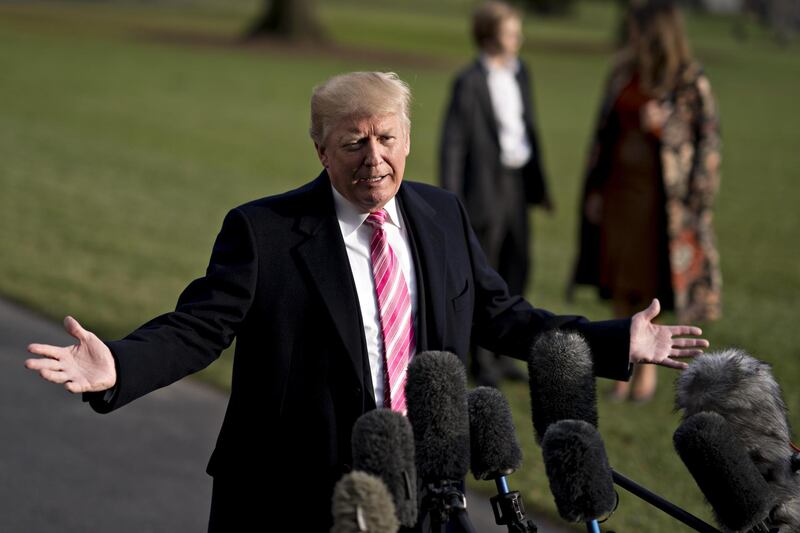 U.S. President Donald Trump speaks to members of the media before boarding Marine One on the South Lawn of the White House in Washington, D.C., U.S., on Tuesday, Nov. 21, 2017. Trump said AT&T Inc.'s $85 billion merger with Time Warner Inc. would be not good for the country, as he left the White House for his Thanksgiving holiday. Photographer: Andrew Harrer/Bloomberg
