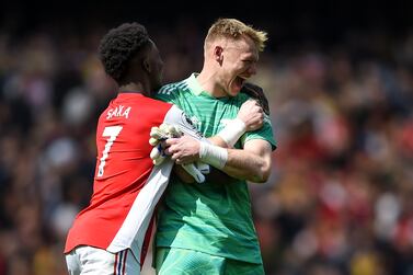 Arsenal players Bukayo Saka (L) and goalkeeper Aaron Ramsdale (R) celebrate after winning the English Premier League soccer match between Arsenal FC and Manchester United in London, Britain, 23 April 2022.   EPA/DANIEL HAMBURY EDITORIAL USE ONLY.  No use with unauthorized audio, video, data, fixture lists, club/league logos or 'live' services.  Online in-match use limited to 120 images, no video emulation.  No use in betting, games or single club / league / player publications