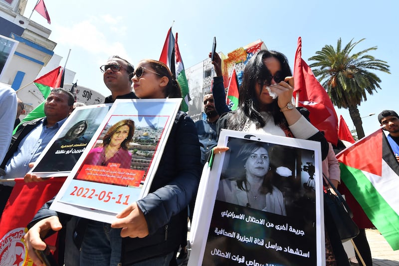 A protest takes place outside the SNJT national journalists' union in Tunis, after the death of Al Jazeera journalist Shireen Abu Akleh, 51, who was shot dead while reporting on armed clashes in the West Bank. AFP