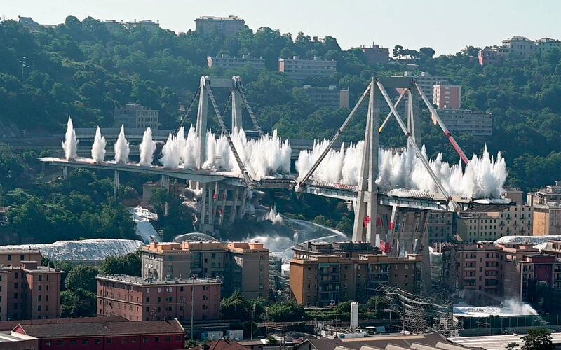 A planned explosion sets off to demolish the remaining spans of the Morandi bridge, in Genoa, Italy. AP