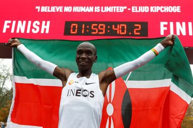 Kenya's Eliud Kipchoge celebrates after crossing the finish line during his attempt to run a marathon in under two hours in Vienna, Austria on October 12, 2019. Reuters