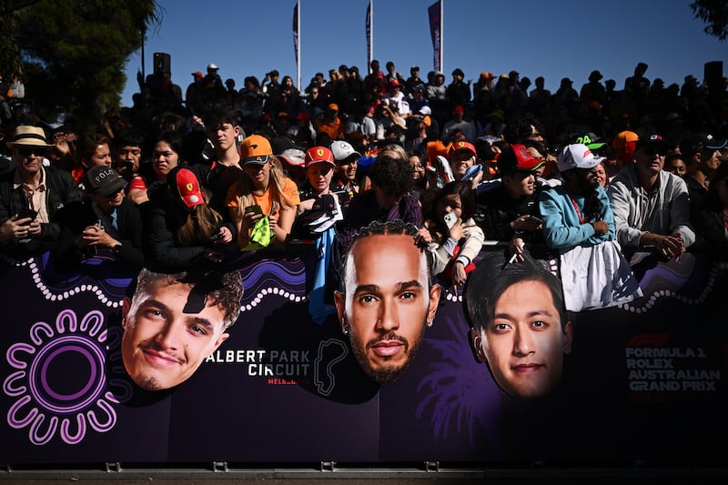 Fans wait for F1 drivers to arrive at the Albert Park Grand Prix Circuit in Melbourne, Australia, 21 March 2024.  The 2024 Australia Formula 1 Grand Prix is held on 24 March.   EPA / JOEL CARRETT AUSTRALIA AND NEW ZEALAND OUT