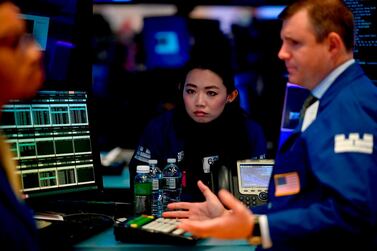 Traders at the New York Stock Exchange. While investor sentiment was boosted last week by a partial trade agreement with China and the UK's possible deal with the European Union, signs of an impending recession have not gone away. AFP