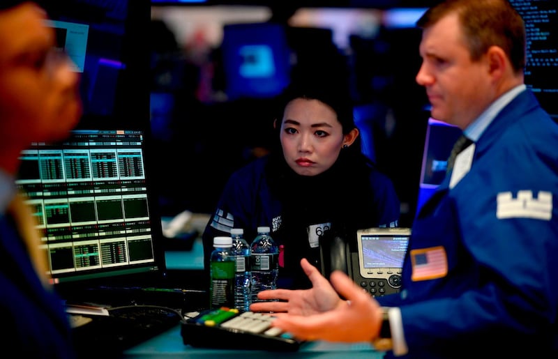 Traders work during the opening bell at the New York Stock Exchange (NYSE) on October 11, 2019, at Wall Street in New York City. Wall Street stocks jumped early Friday on optimism for progress in US-China negotiations, including a possible agreement to pause new tariff measures. The talks in Washington, now in their second day, were given a positive push by US President Donald Trump, who said the negotiations were "going really well" and was scheduled to meet later Friday with China's top trade envoy Liu He. / AFP / Johannes EISELE

