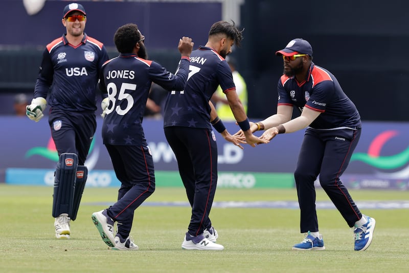 United States' Muhammad Ali-Khan, second right, celebrates with teammates after the dismissal of India batter Rishabh Pant. AP