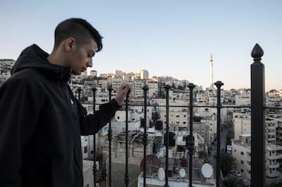 Palestinian Yehiya Derbas ,17,on the balcony of his home in  Issawiyah, a hardened and impoverished east Jerusalem neighborhood on March 9,2019.The day the Trump administration announced last December that it would be moving the United States Embassy to Jerusalem, Yehiya DerbasÕ life changed forever.  Derbas, then a slight 16-year-old, joined in Palestinian protests against the move. And like many young men before and after him, Derbas told The National that Israeli forces shot him and later imprisoned him for one year on charges related to the dayÕs violence.  

Upon his release in early February, now marked as an ex-con, Derbas returned to a city that in most ways has remained the same day-to-day Ñ but that intangibly has significantly changed. (Photo by Heidi Levine For The National).
