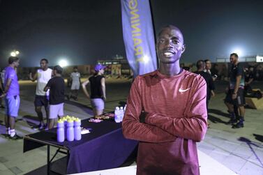 Marius Kipserem prepares for marathon training with members of the public. Victor Besa / The National 