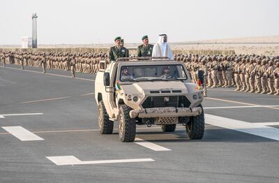 ZAYED MILITARY CITY, ABU DHABI, UNITED ARAB EMIRATES - November 28, 2017: HH Sheikh Mohamed bin Zayed Al Nahyan Crown Prince of Abu Dhabi Deputy Supreme Commander of the UAE Armed Forces (center R), inspects the cadets during a graduation ceremony for the 8th cohort of National Service recruits and the 6th cohort of National Service volunteers at Zayed Military City. Seen with HE Lt General Hamad Thani Al Romaithi, Chief of Staff UAE Armed Forces (center L) and Brigadier Faisal Mohamed Al Shehhi (C).

( Hamad Al Kaabi / Crown Prince Court - Abu Dhabi )
—