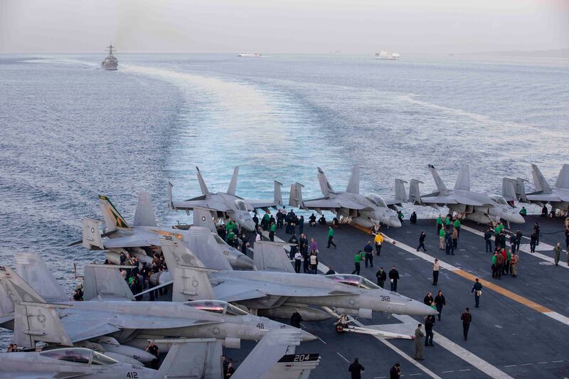 The USS Dwight D Eisenhower carrier strike group crosses the Strait of Gibraltar on October 28. US Navy / AFP