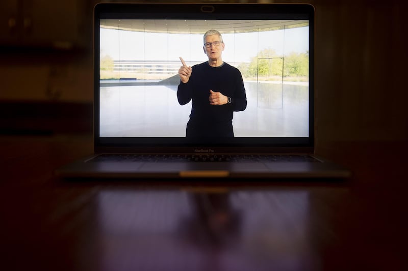 Tim Cook, chief executive officer of Apple Inc., speaks during a virtual product launch seen on a laptop computer in Tiskilwa, Illinois, U.S.  Bloomberg