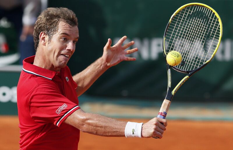 France's Richard Gasquet hits a return to Switzerland's Stanislas Wawrinka during a French tennis Open round of 16 match at the Roland Garros stadium in Paris on June 3, 2013. AFP PHOTO / PATRICK KOVARIK
 *** Local Caption ***  259689-01-08.jpg