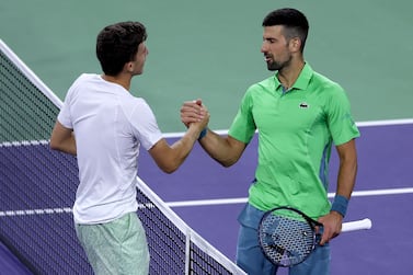 INDIAN WELLS, CALIFORNIA - MARCH 11: Luca Nardi of Italy is congratulated by Novak Djokovic of Serbia after their match during the BNP Paribas Open at Indian Wells Tennis Garden on March 11, 2024 in Indian Wells, California.    Matthew Stockman / Getty Images / AFP (Photo by MATTHEW STOCKMAN  /  GETTY IMAGES NORTH AMERICA  /  Getty Images via AFP)