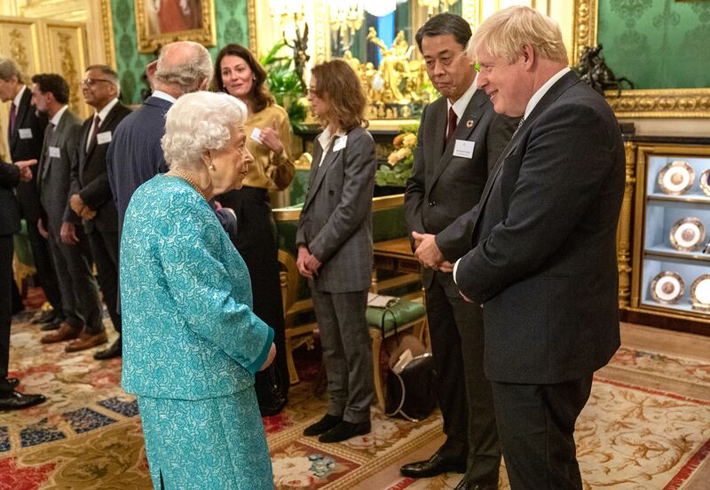 Queen Elizabeth greets British Prime Minister Boris Johnson. The lavish reception on Tuesday evening marked the end of the UK’s Global Investment Summit.