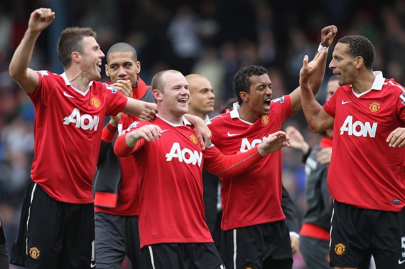 BLACKBURN, ENGLAND - MAY 14:  Michael Carrick (L),Chris Smalling (2L),Wayne Rooney (3L), Nani (2R) and Rio Ferdinand of Manchester United celebrate clinching the title during the Barclays Premier League match between Blackburn Rovers and Manchester United at Ewood Park on May 14, 2011 in Blackburn, England.  (Photo by Michael Steele/Getty Images)