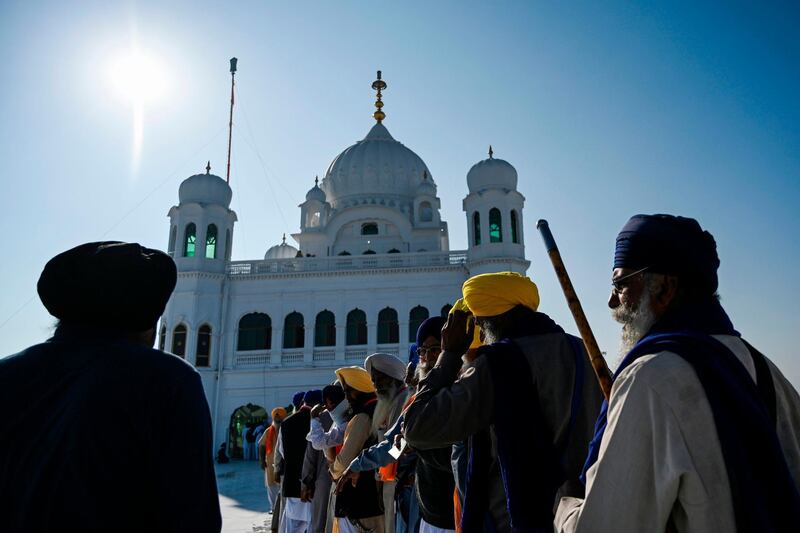 Sikh Pilgrims stand in a queue to visit the Shrine of Baba Guru Nanak Dev at Gurdwara Darbar Sahib in Kartarpur, near the Indian border. AFP
