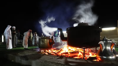 Traditional Saudi coffee is brewed on an outdoor fire. AFP