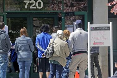 People queue outside the Utah Department of workforce Services, in Salt Lake City. The markets should have been cautious about reading too much into May’s more encouraging US employment figures. Associated Press