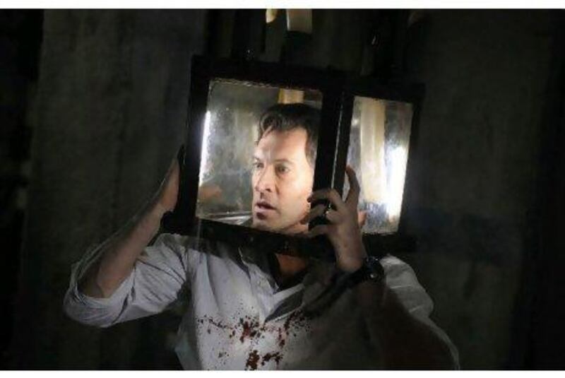 Agent Straum, played by Scott Patterson, finds himself in a tight spot in Saw V, which was directed by David Hackl, the production designer on the first four films.