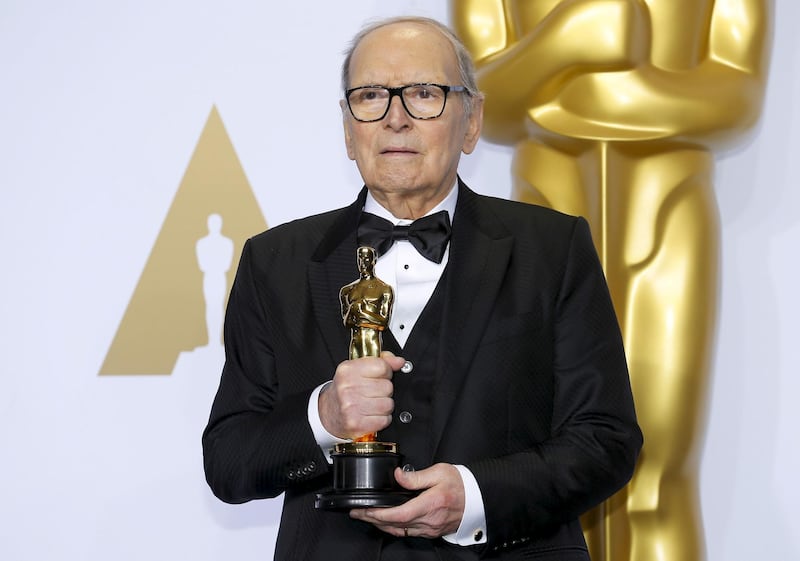 FILE PHOTO: Italian composer Ennio Morricone poses with his Oscar for Best Original Score for "The Hateful Eight," during the 88th Academy Awards in Hollywood, California February 28, 2016.  REUTERS/Mike Blake/File Photo