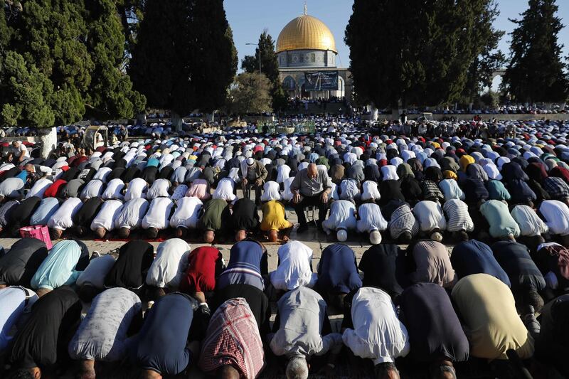 Palestinian Muslims perform the Eid Al Adha morning prayers at the Al-Aqsa Mosque compound, Islam's third most holy site, in the Old City of Jerusalem.  AFP