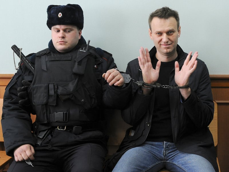 Mr Navalny handcuffed in court in Moscow, in 2017. AP