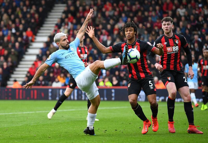 Manchester City's Sergio Aguero in action with Bournemouth's Nathan Ake. Reuters