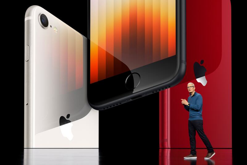 Apple CEO Tim Cook showcasing the third generation iPhone SE featuring 5G and the A15 Bionic chip on March 8, 2022.   EPA