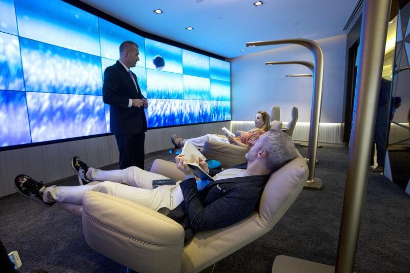 The Relax & Recline area features a large video wall made up of 27 individual screens, soothing sound and lighting, and is furnished with six Poltona Frau leather recliners. Christopher Pike / The National