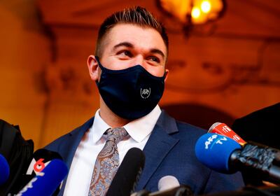 US former serviceman Alek Skarlatos speaks to the press at the "Palais de Justice" courthouse in Paris, on November 20, 2020, on the second day of the trial of Ayoub El Khazzani, a Moroccan man whose attempted terror attack on an Amsterdam-Paris Thalys train in 2015 was foiled by passengers, including Sadler who tackled him along with his friends Spencer Stone and Alek Skarlatos, then off-duty US soldiers. Ayoub El Khazzani and three alleged accomplices went on trial in Paris on November 16 for the attempted terror attack foiled by passengers. Gunman Ayoub El Khazzani was tackled by passengers shortly after emerging bare-chested and heavily armed from a toilet on a Thalys high-speed train on August 21, 2015. There were some 150 passengers in the carriage with Khazzani, who had an AK47 slung over his back, and a bag of nearly 300 rounds of ammunition. / AFP / Thomas SAMSON

