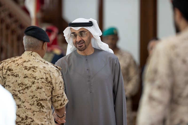 President Sheikh Mohamed greets a member of the Bahrain delegation upon arriving at Sakhir Air Base.