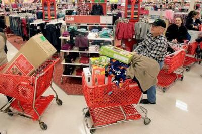 FILE - In this Nov. 27, 2009 file photo, the line to check out winds through the store during the traditional Black Friday shopping day at the Target store in Mayfield Hts., Ohio. Retail sales rose more than expected in November, boosting hopes that the all-important consumer sector will support the fragile recovery.(AP Photo/Amy Sancetta, File) *** Local Caption ***  NYBZ139_Economy_Retail_Sales.jpg