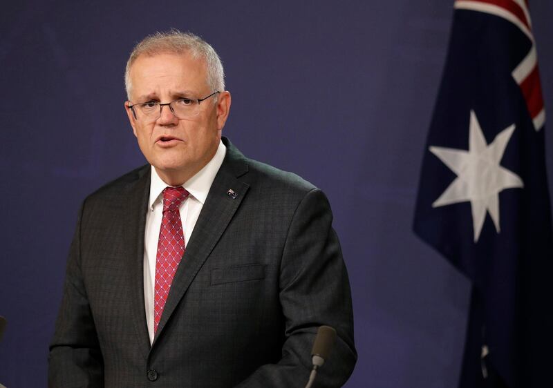 Australia's Prime Minister Scott Morrison comments at a press conference in Sydney, Australia, Tuesday, April 27, 2021, after reports of a senior Australian security bureaucrat warned his staff that free nations "again hear the beating drums" of war, as military tensions rise in the Asia-Pacific region. Morrison did not directly answer when asked at a news conference whether he agreed that the drums of war were beating. (AP Photo/Rick Rycroft)