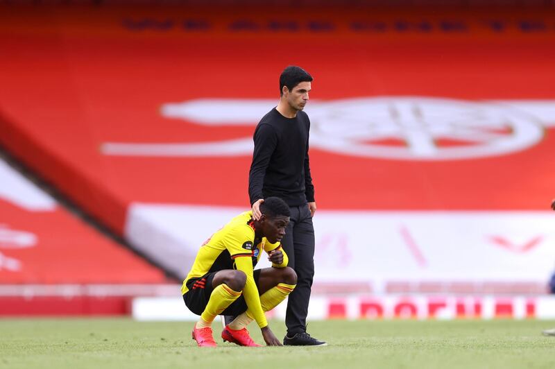 Watford's Christian Kabasele is consoled by Arsenal manager Mikel Arteta. AP Photo