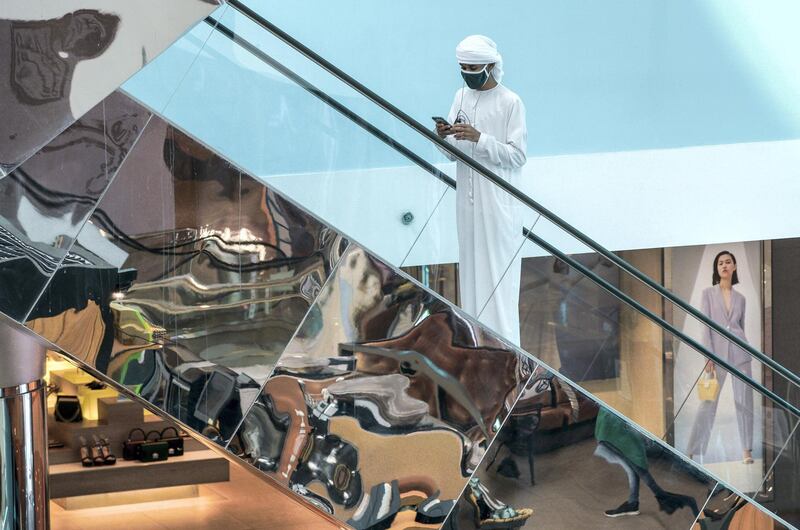 Abu Dhabi, United Arab Emirates, May 24, 2020.  
    Abu Dhabi residents practice social distancing at Mushrif Mall while doing some Eid shopping.
Victor Besa  / The National
Section:  Standalone / Stock