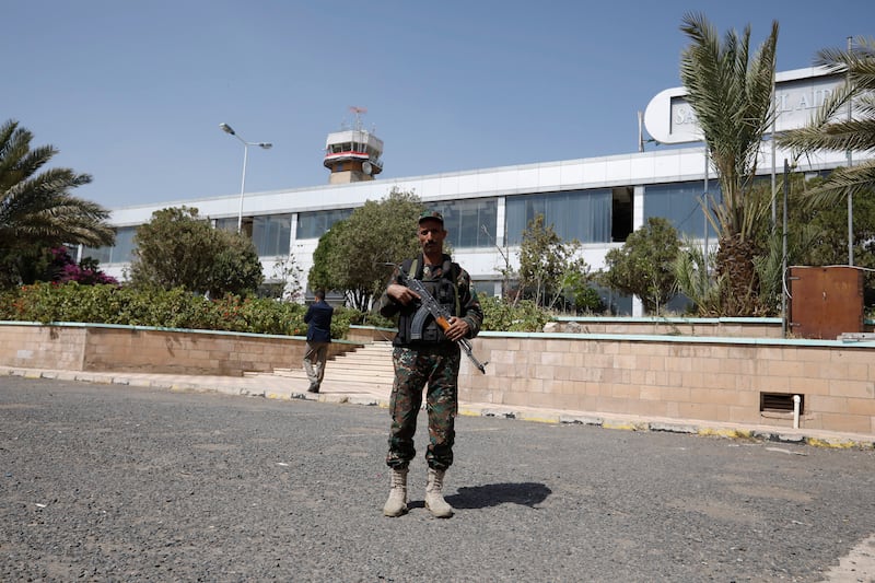 A fighter stands guard outside Sanaa's airport in September 2021. A drone launched from the airport was aimed at Saudi civilians at King Abdullah bin Abdulaziz Airport in the southern city of Jizan, state media reported. Photo: EPA