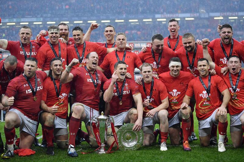 CARDIFF, WALES - MARCH 16: The Wales team celebrate winning the Six Nations with the trophy after the Guinness Six Nations match between Wales and Ireland at Principality Stadium on March 16, 2019 in Cardiff, Wales. (Photo by Dan Mullan/Getty Images)